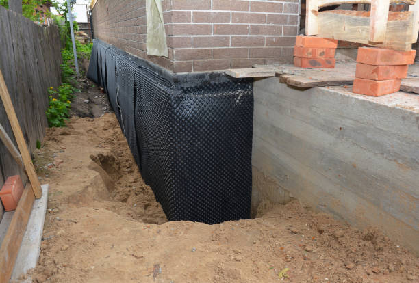 SJ Waterproofing Pros technician performing targeted Emergency Waterproofing assessment in Fayetteville, NY